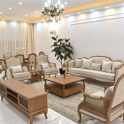  An elegant living room set featuring a sofa, armchairs, and a coffee table.