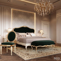 A luxurious bedroom featuring a dark green velvet bed with gold accents, complemented by matching furniture and a crystal chandelier.
