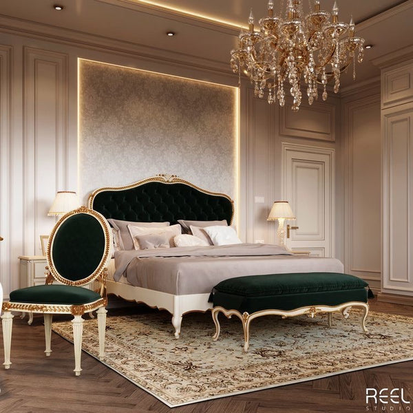 A luxurious bedroom featuring a dark green velvet bed with gold accents, complemented by matching furniture and a crystal chandelier.
