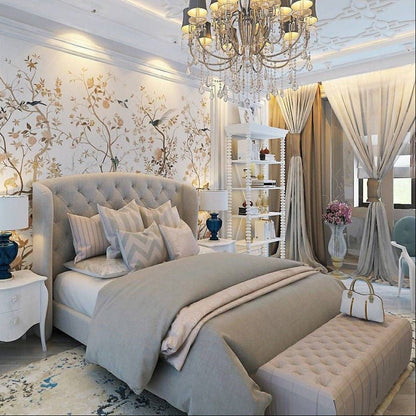 Elegant bedroom with tufted beige headboard bed, neutral bedding, and matching end-of-bed ottoman bench.