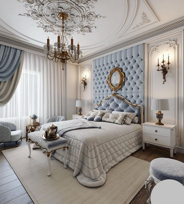 A traditionally styled bedroom exuding luxury with its tufted headboard, detailed ceiling, and refined furnishings.