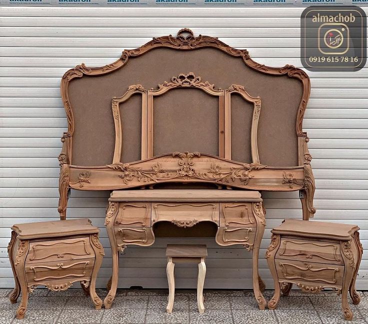 A wooden Akfa KFA Bed with a carved headboard side tables and dresser.